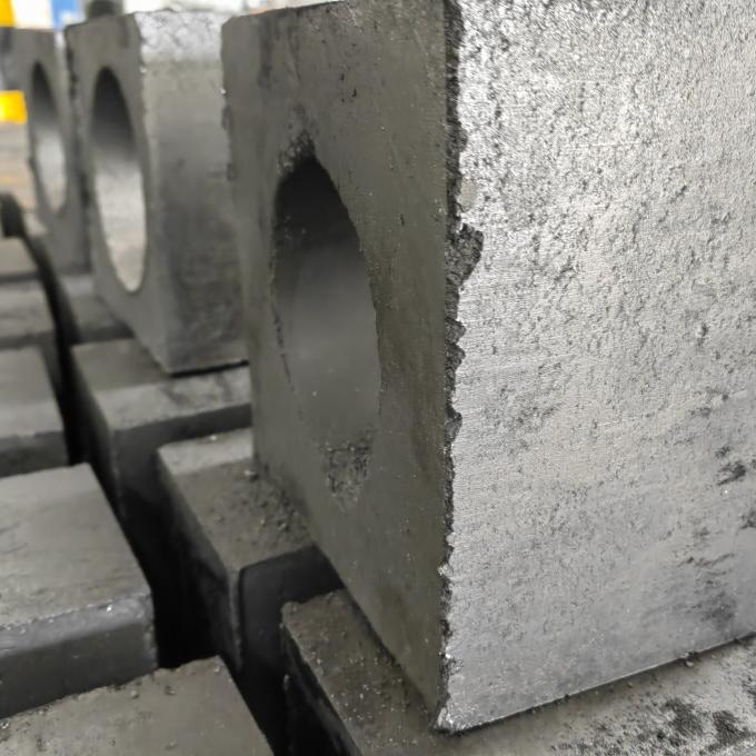 Bloc réfractaire de puits de récipient de distribution pour la coulée continue
